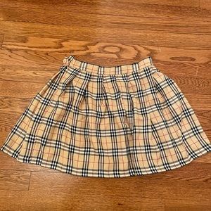 nude, black, red, and white plaid mini skirt